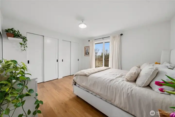 The primary bedroom showcases the new Shaker Sold Core doors that were installed throughout the main floor.