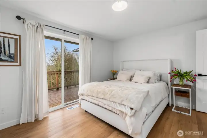 It sparkles with it's own glass doors to the deck and those wide plank LVP floors.