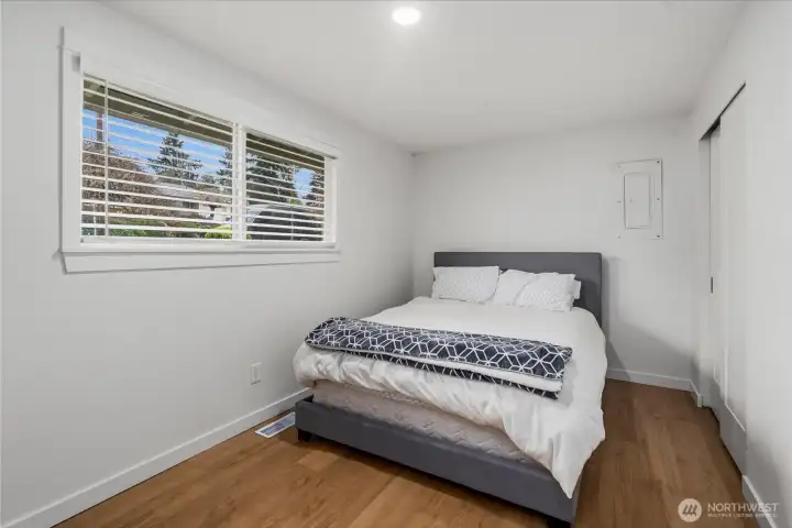 Bedroom 2 showcases the new blinds that were installed throughout the main floor.