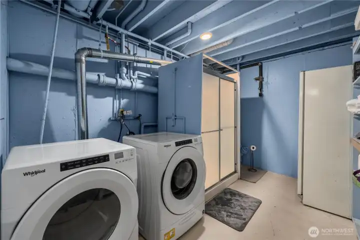 The 3/4 bath downstairs is big enough to share space with the washer and dryer and a freezer.