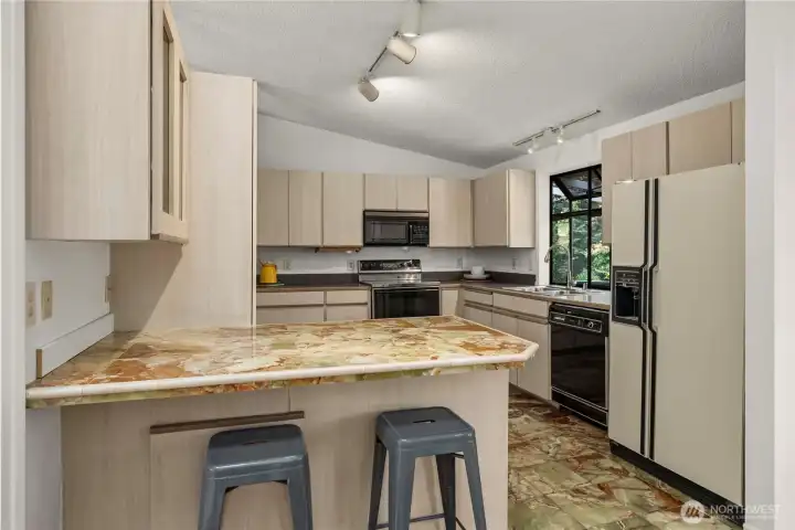 Garden window, tile flooring and counters