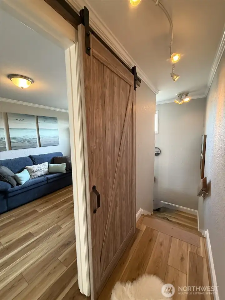 extra special touches including this barn door for space saving