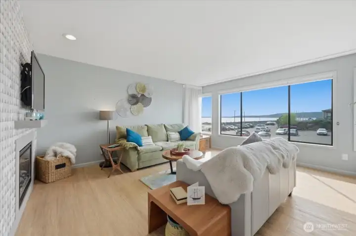 West wall of windows offers Puget Sound views, Maury Island and Mainland views.  Watch the shipping traffic, the pleasure boats and the sea life.  Storm watching is great fun and you can turn on the easy fireplace to stay cozy.