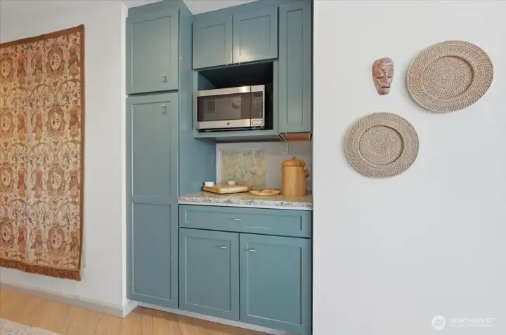 Butler pantry with storage, Micro cubby, flat pan storage, tall deep pantry cabinet and deep drawer.  Wine storage drawers with racks in lower cupboard.  Perfect little snack and drink bar for your get together or light evening meal service.