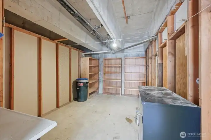 Giant Storage space. Approx. 10x 20 need to verify.  Outfitted with workbench, outlets and lighting.