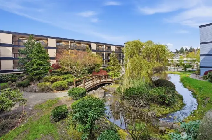 Garden paths lead to the fun outdoors amenities including a pool, hot tub and BBQ picnic area on the end of the walk.