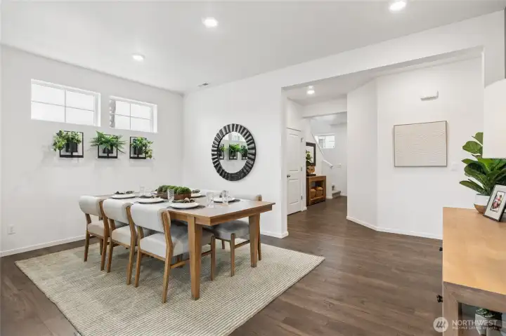 Formal Dining, very open concept living area. Actual home is under construction and finishes, materials, and colors will vary. See site agent for details.