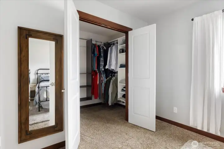 Primary bedroom walk in closet.