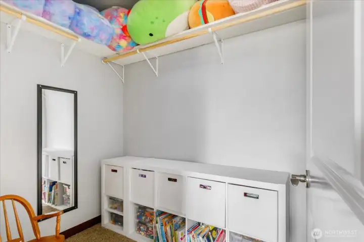 Large walk in closet (or secret playroom!) in second bedroom.