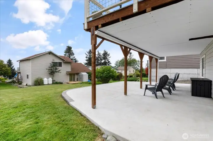 Note the covering under the deck with the ingenious gutter. Covered, dry patio!