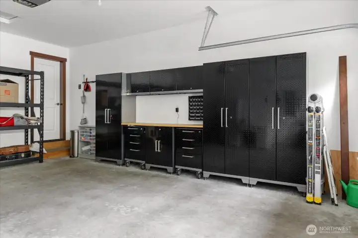 This amazing cabinet system in the garage stays with the home!