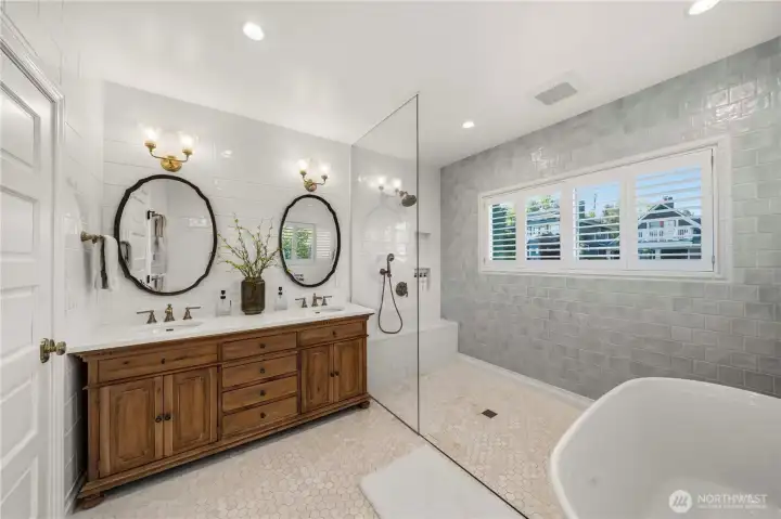 Stunning primary bathroom, large step in shower, soaking tub all in a spa like setting.