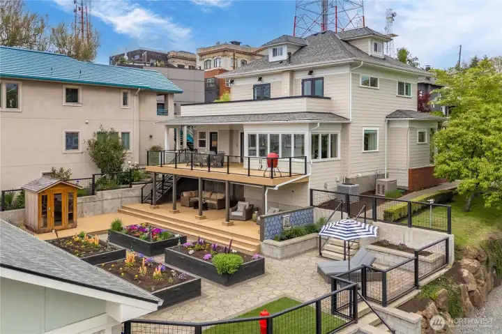 Stunning outdoor living with tiered trex decks, garden boxes PLUS entertaining space. Don't miss the turf area for your pups!