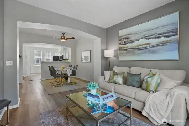 Easy transition between the living and dining areas enhances both functionality and entertaining potential.