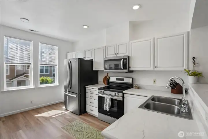 Functional kitchen with ample storage, generous prep space, and updated appliances.