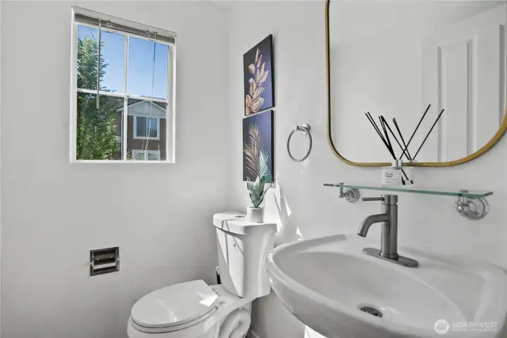Powder room conveniently located off the kitchen.