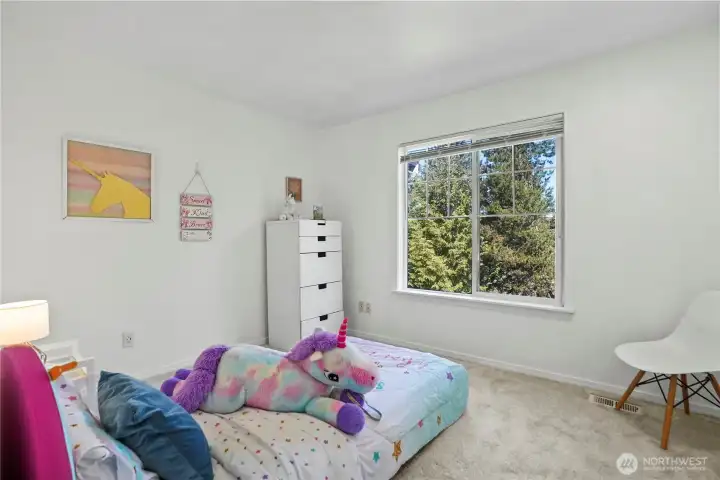 Versatile secondary bedroom ideal for guests, a home office, or additional living space.