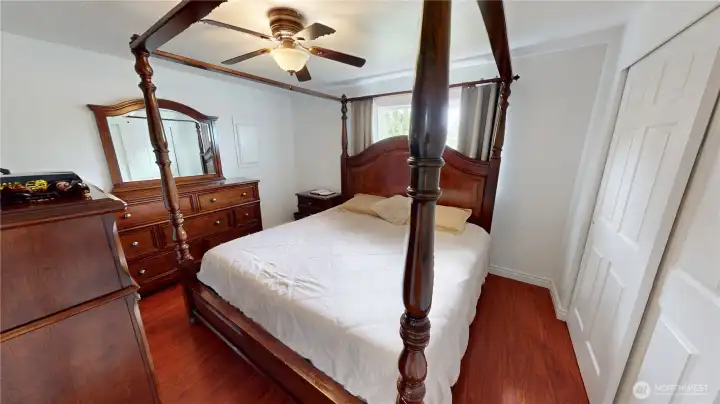Primary bedroom with sliding closet doors