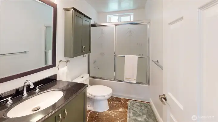 full bathroom in primary living area off bedrooms