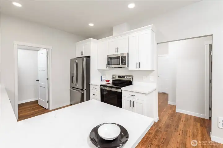 Entry from main living space to bedrooms and back door. Entry from main living space to bedrooms and back door.
