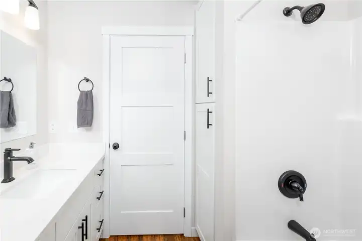 New tub shower combo and an ample linen closet in main bath. New tub shower combo and an ample linen closet in main bath.