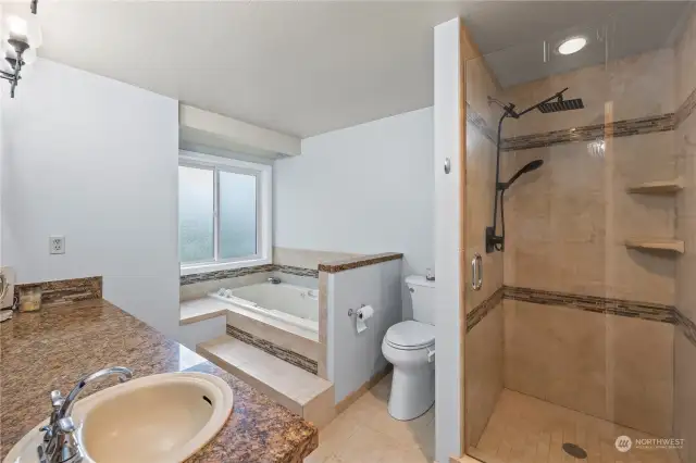 Primary 5-piece en-suite includes generous  soaking tub.