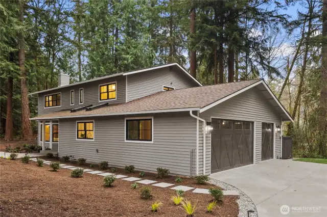 Arrival at the home is stunning, with a fully elevated exterior with oversized garage, new windows, newer roof, new gutters, new driveway and new landscape surround. It's welcoming and invites you and your guests to enjoy all this property has to offer.