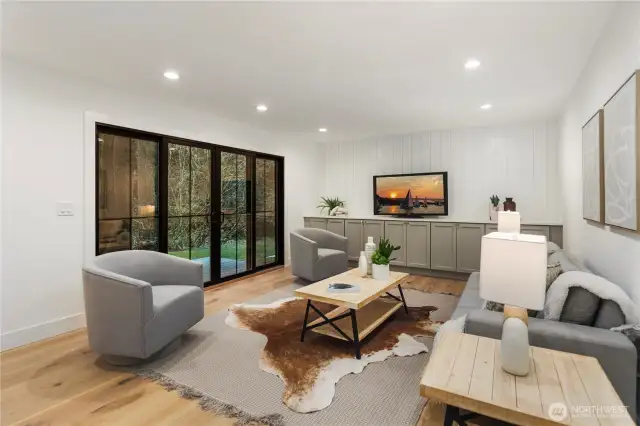 right off the kitchen you can enjoy being part of the crowd, this expansive living space is perfect for those casual nights in and movie night! Tons of room to relax and enjoy a show or walk-out in to nature through those gorgeous new doors!