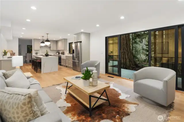 this view really gives perspective on how expansive this living/kitchen space truly is...it is a dream area that you will surely spend most of your time. Open the doors and flow onto your new deck and enjoy the peace of living amongst the evergreens.