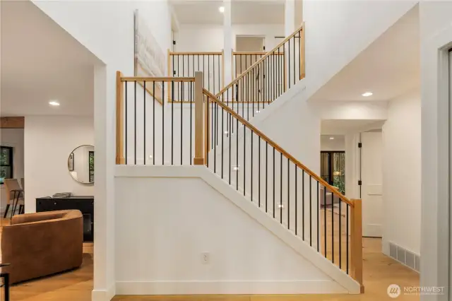 Stunning 2 story entry, with new staircase, new wide plank oak floors, and an easy flowing floor plan that lives large.