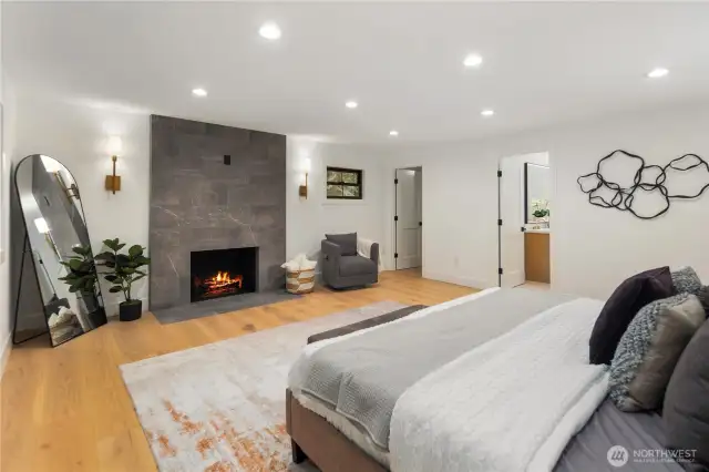 Spacious is the theme in this space, the primary does not disappoint form the wide plank oak floors to that designer tiled fireplace, you will not want to leave your room!