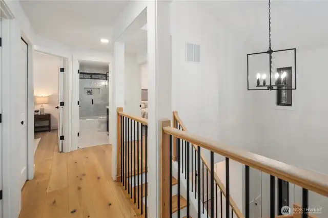 The landing of this house is bright, open and full of natural light. The stunning chandelier overhangs the 2 story entrance and the staircase is the art piece of the space. All living quarters are offered upstairs.