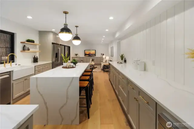 This kitchen is a moment all by itself...from the minute you walk in it catches your eye with the expansive eat-at island, the bar with beverage center, the gorgeous appliances and stunning designer styled cabinetry. Don't forget to admire those statement lighting pieces above head, they set the tone for this whole space.