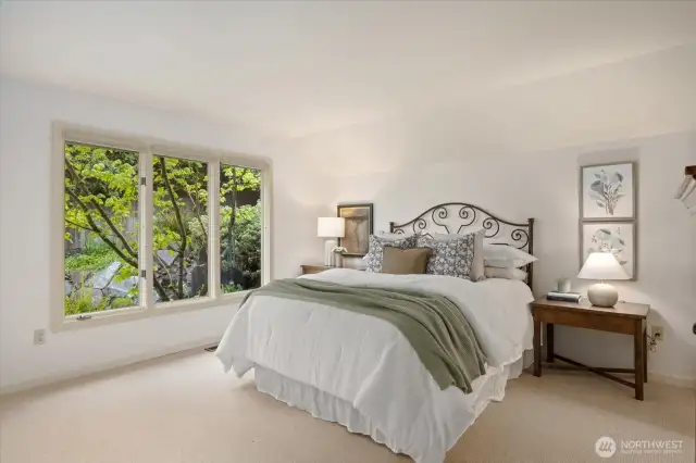 Guest bedroom with attached full bathroom with tub and walk in shower.