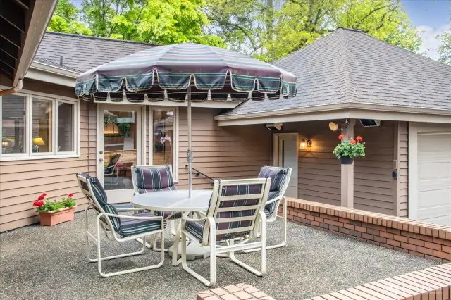 Front porch off of the kitchen. BBQ fits nicely under the overhang.