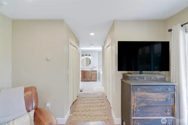 Primary bedroom, closets and bath
