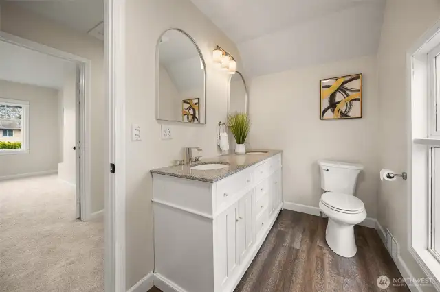 Upstairs full bath with updated with vanity, mirrors and lighting