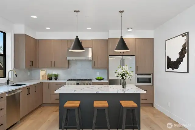 This kitchen! Belmont cabinets, Designer lighting, stainless Monogram appliances, recycle center!