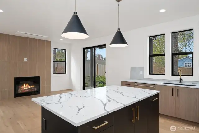 Love how the black windows and beautiful wood floors look together!