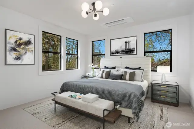 What a fabulous Primary bedroom with the backdrop of the trees