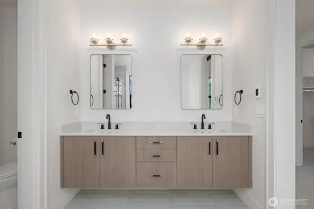 I love the way these cabinets float. Designer hardware, fixtures and quartz countertops!