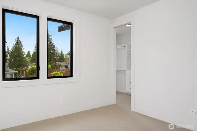 Secondary upstairs bedroom w/ large closet, great light!