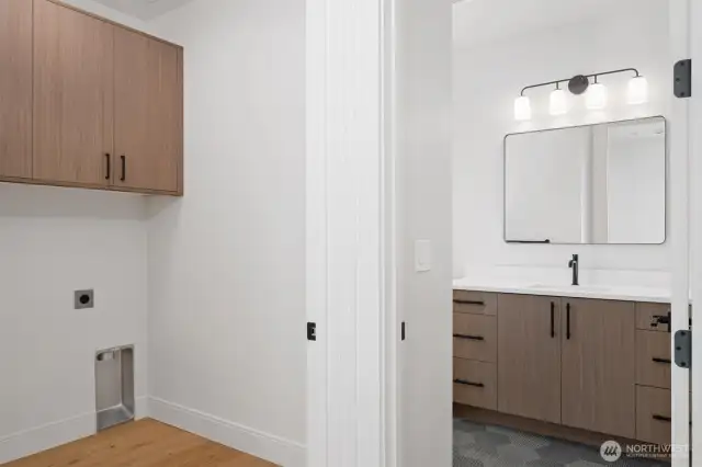 Upstairs laundry located near bathroom