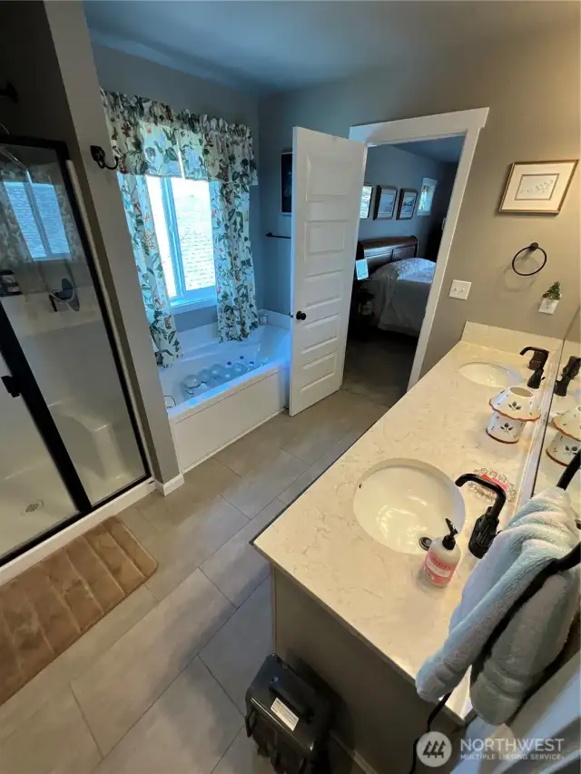 Master bath with jacuzzi and large shower