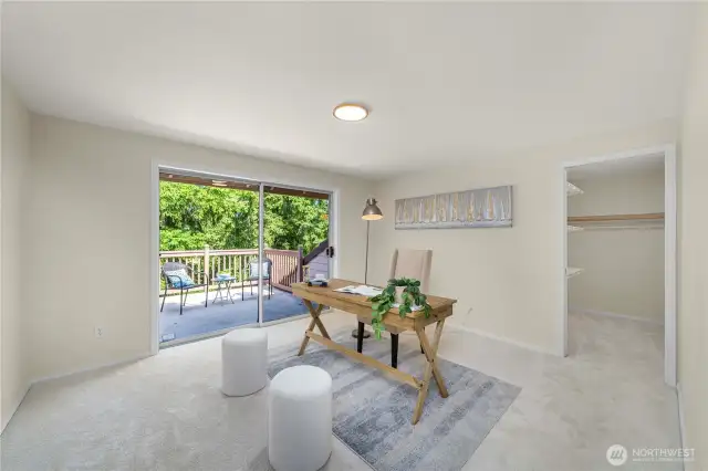 Upper level office with roof top deck and walk in closet.