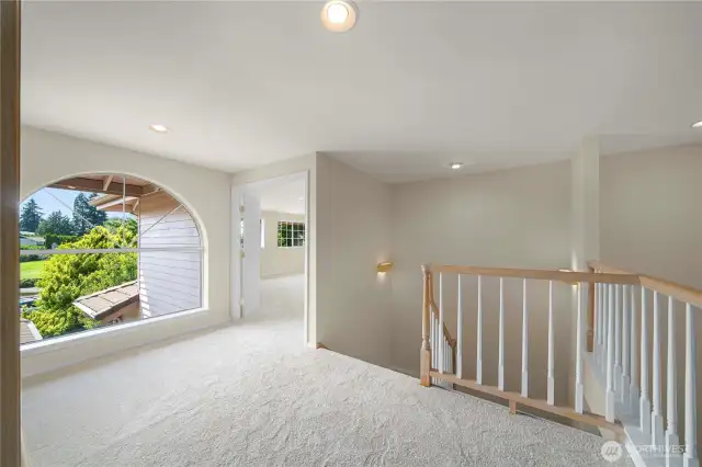 Loft area on top of the stairs leads to the large bonus room.