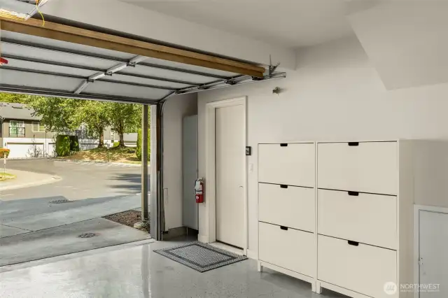 Garage has epoxy floors & built-in storage