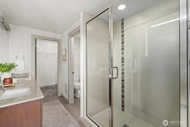 Primary bathroom with double vanity and walk-in shower