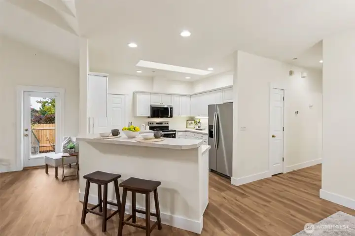 Dining peninsula with additional seating/dining space.