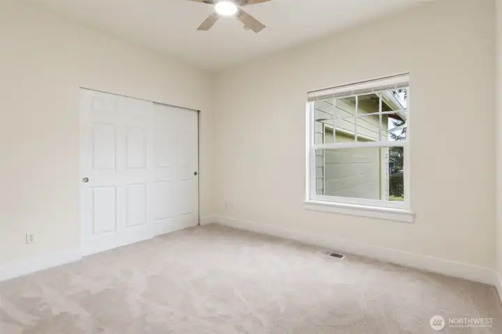 Bedroom 1 with new ceiling fan.